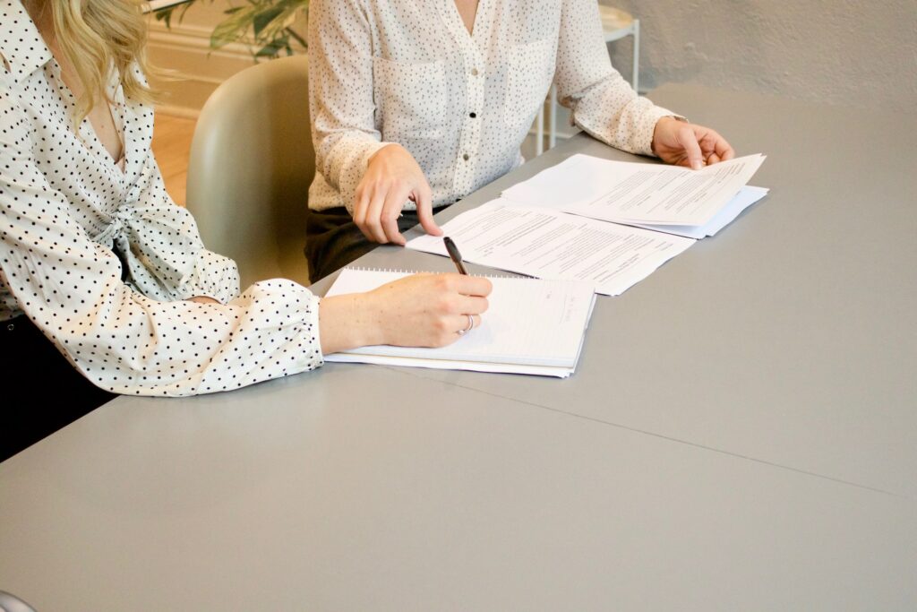 man signs documents